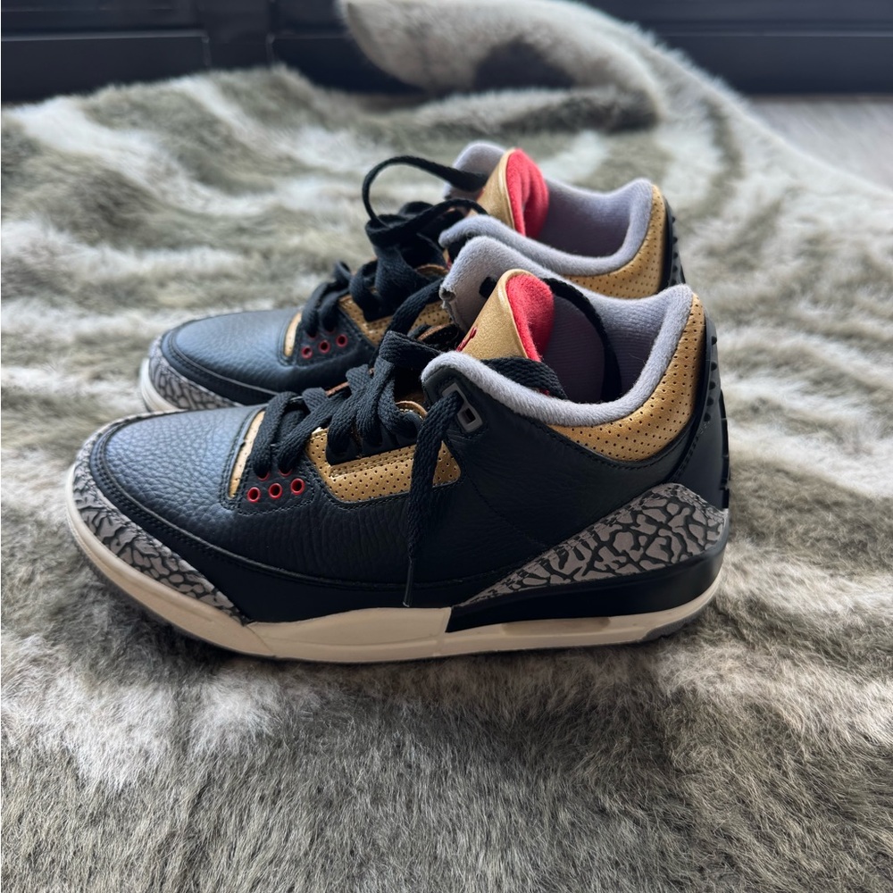 Jordan Black and Gold Sneakers with Retro Design